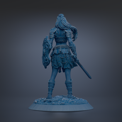 A statue of a warrior standing with a shield and sword, wearing a long skirt and boots.