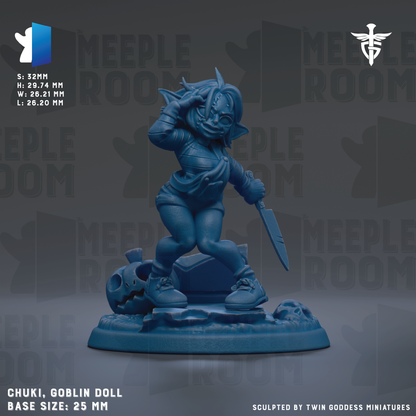 A blue figurine of a character, likely a doll, with a skull and other objects on a base. The figurine is described as a "Chuki, Goblin Doll" and is shown in a 3.5mm base size.