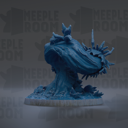 a blue, abstract sculpture with a textured, organic shape resembling a wave or sea creature.