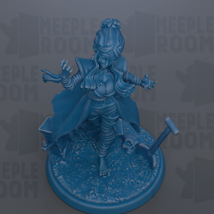 A blue figurine of a woman with long hair and a flowing cape, standing on a base with a skull and a broken sword.