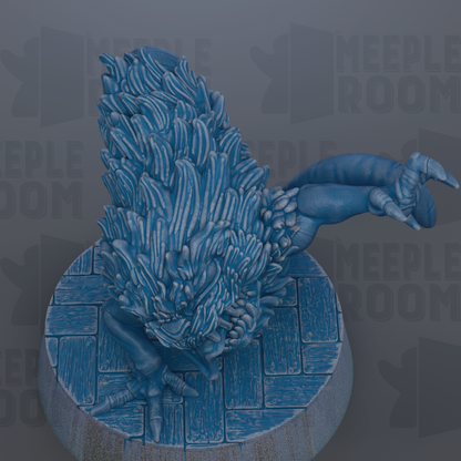 A blue, textured figurine of a creature with a large head and long, curved claws, sitting on a circular base.