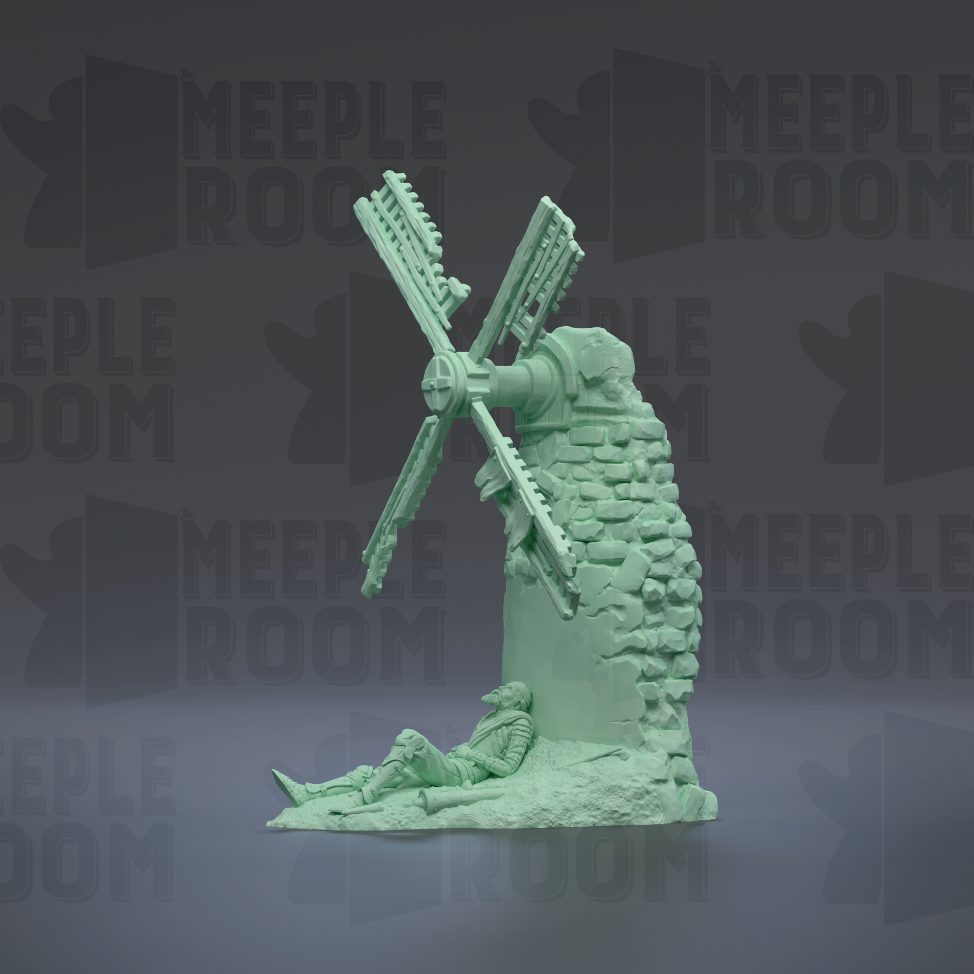 A green-colored statue of a windmill with a person sitting on the ground in front of it.