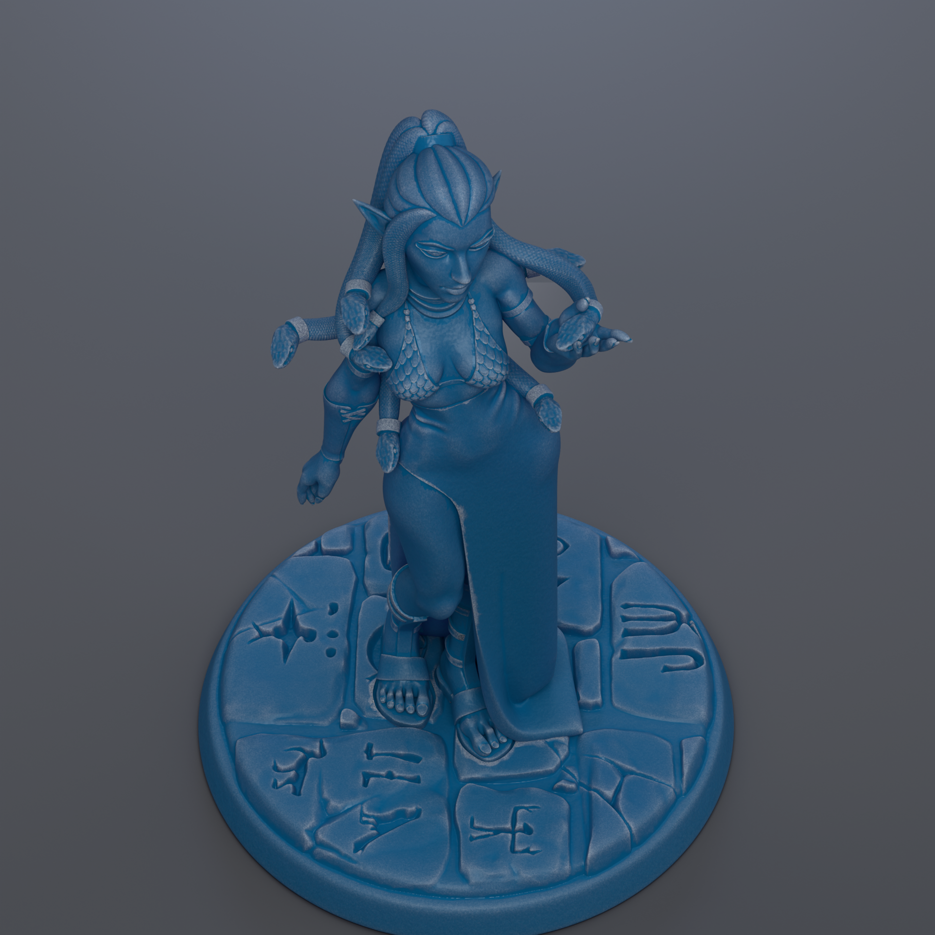 A blue figurine of a woman with multiple arms standing on a circular base with various symbols and designs.
