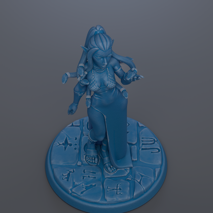 A blue figurine of a woman with multiple arms standing on a circular base with various symbols and designs.