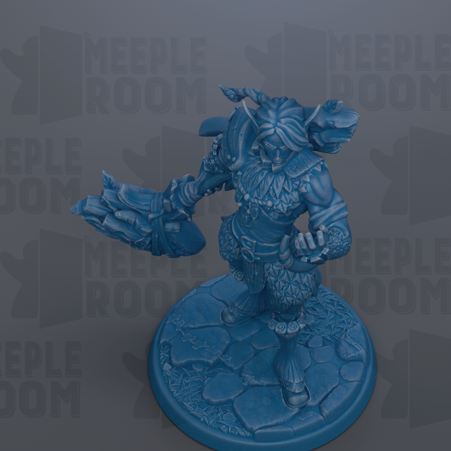 A blue figurine of a fantastical creature, possibly a dragon or serpent, standing on a rocky base.