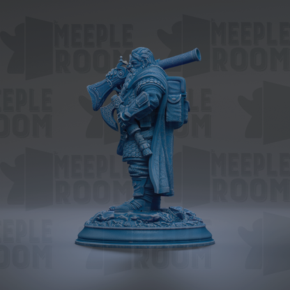A blue figurine of a person holding a large object, possibly a pipe or a shield, standing on a base.