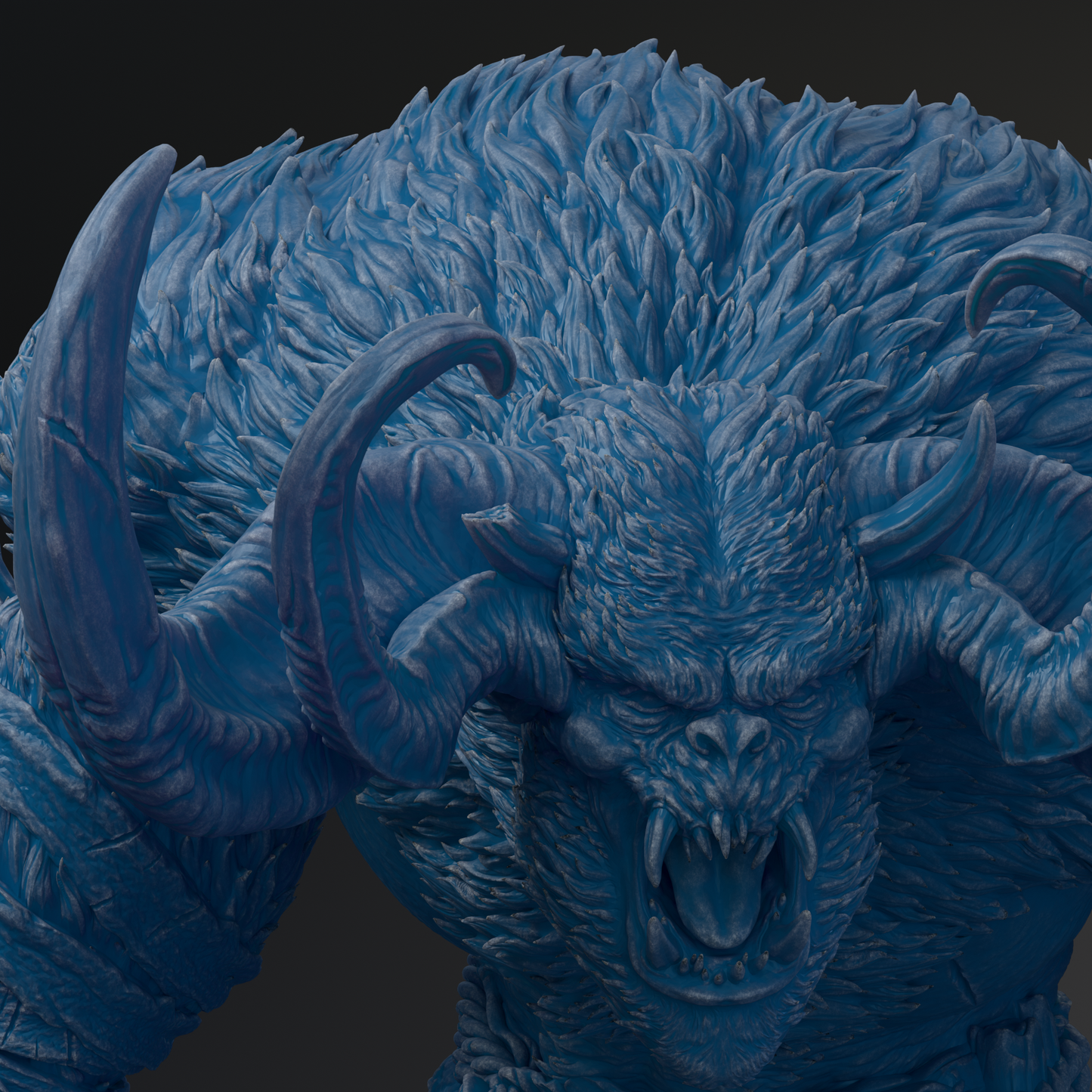 A close-up view of a detailed, blue-colored monster sculpture with sharp teeth and a fierce expression.