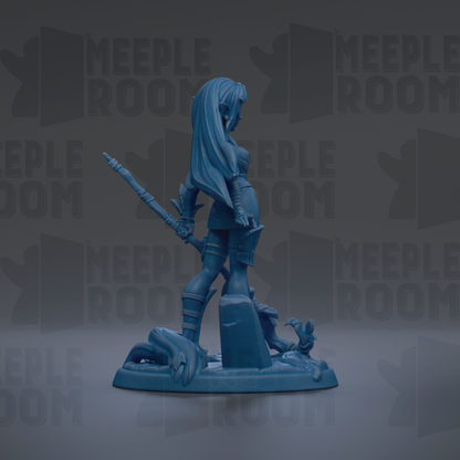 A blue figurine of a woman with long hair and a sword stands on a base, surrounded by various other figurines and text.