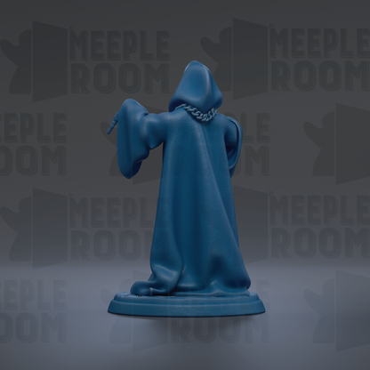 A blue figurine of a figure with a hooded cloak, standing on a base and facing away from the camera.