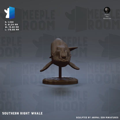 a sculpture of a right whale, which is a figurative representation of a whale. The sculpture is placed on a stand and is the main focus of the image.