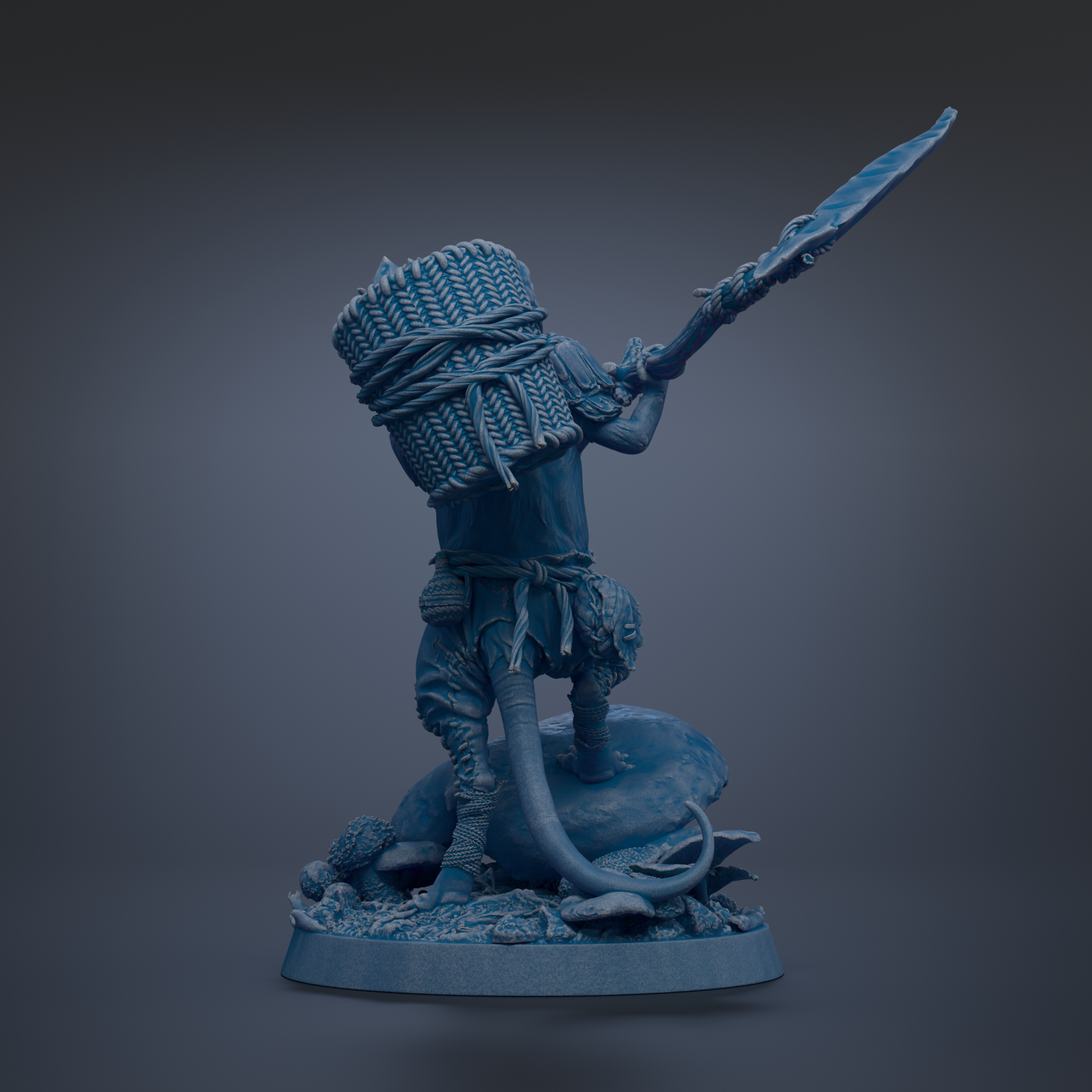 A blue figurine of a warrior standing on a rock, holding a spear and a bundle of sticks.