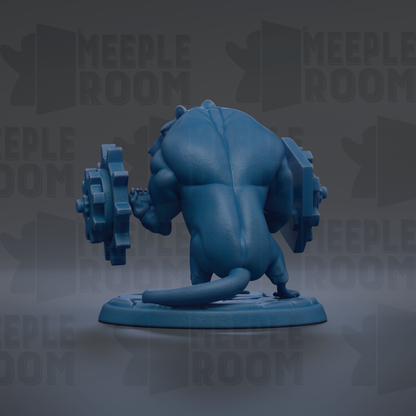 A blue figurine of a muscular, cartoon-like creature with a large head and a smaller body, holding a large gear-like object in its hands.