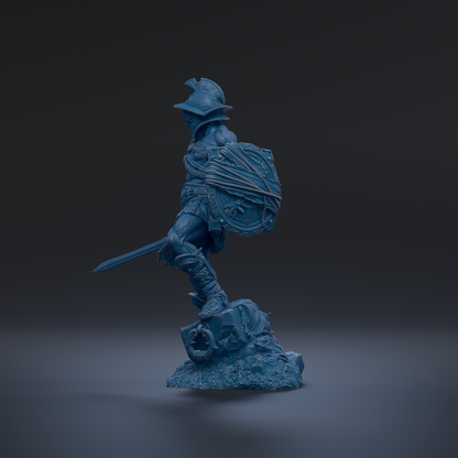 A blue statue of a warrior figure holding a shield and sword, standing on a rock formation against a dark background.