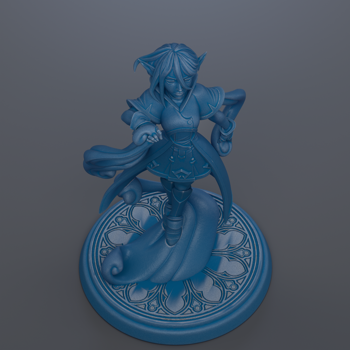 A blue figurine of a character with a flowing cape and a flowing skirt, standing on a decorative base with a floral pattern.