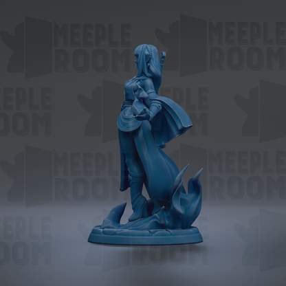 A blue figurine of a woman with long hair and a flowing cape, standing on a base with flames or fire behind her, against a dark background with repeated text.