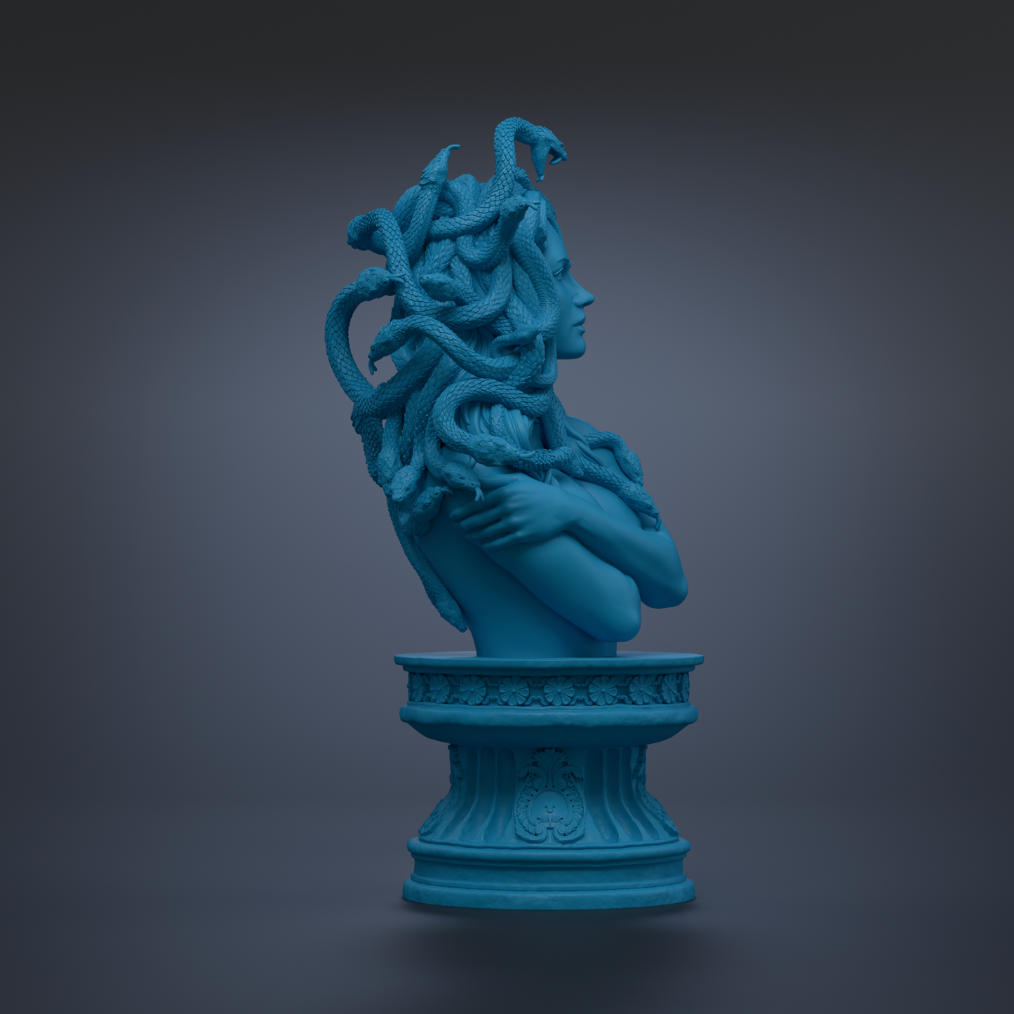 A blue bust sculpture of a woman with snakes wrapped around her head and neck, standing on a pedestal.