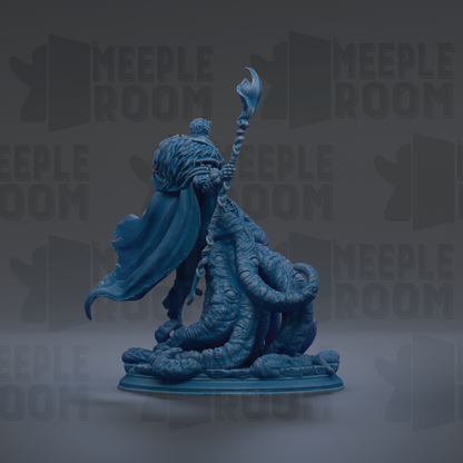 A blue statue of a figure holding a staff and standing on a platform.