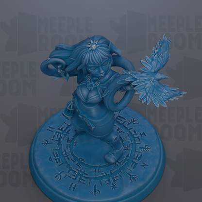 A blue figurine of a woman with long hair and a crown, holding a bird, is displayed on a circular base with intricate designs.