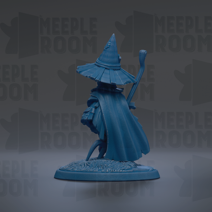 A blue figurine of a wizard or magical figure, wearing a pointed hat and holding a staff, is displayed against a dark background with repeated text.