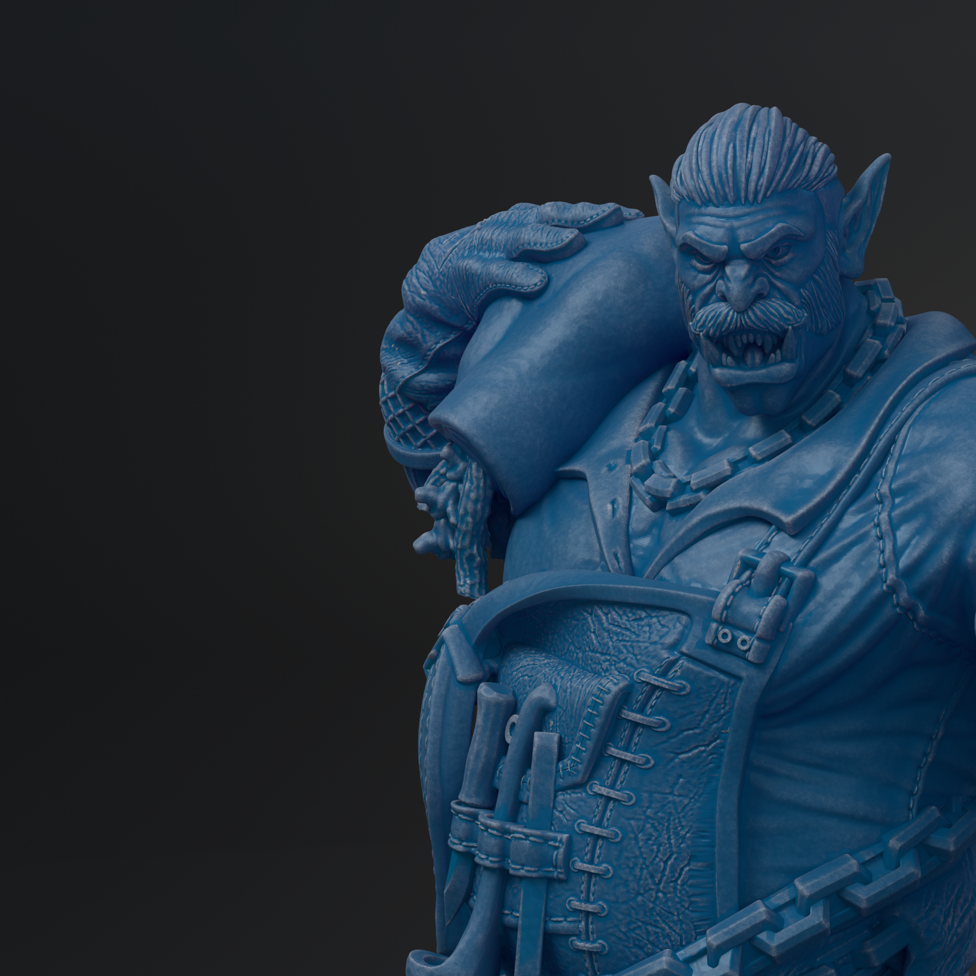 A close-up view of a blue, detailed statue depicting a fierce-looking monster or dragon-like creature with sharp teeth and claws.