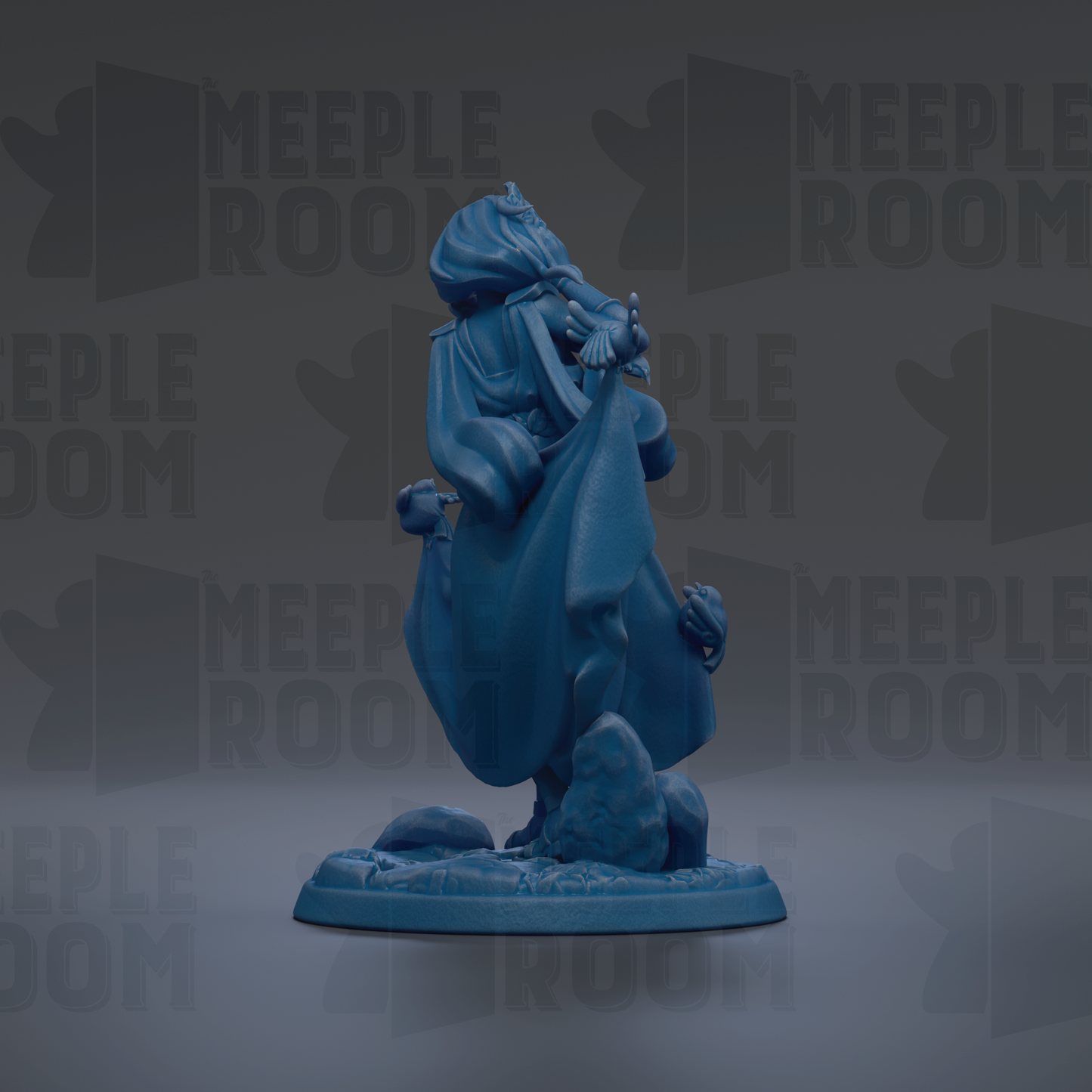 A blue figurine of a person standing on a rock, with a flowing robe and holding a staff.