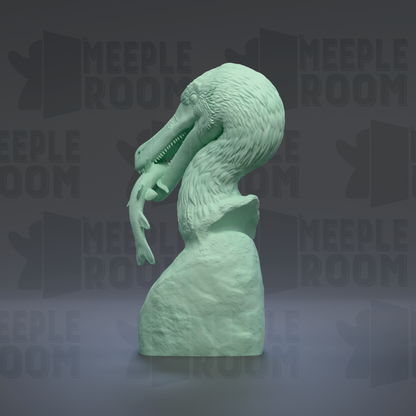 A green sculpture of a bird-like creature with a long beak and sharp teeth, standing on a rock.