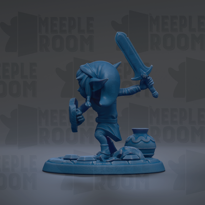 A blue figurine of a character holding a sword and shield, standing on a base with a vase and other objects.