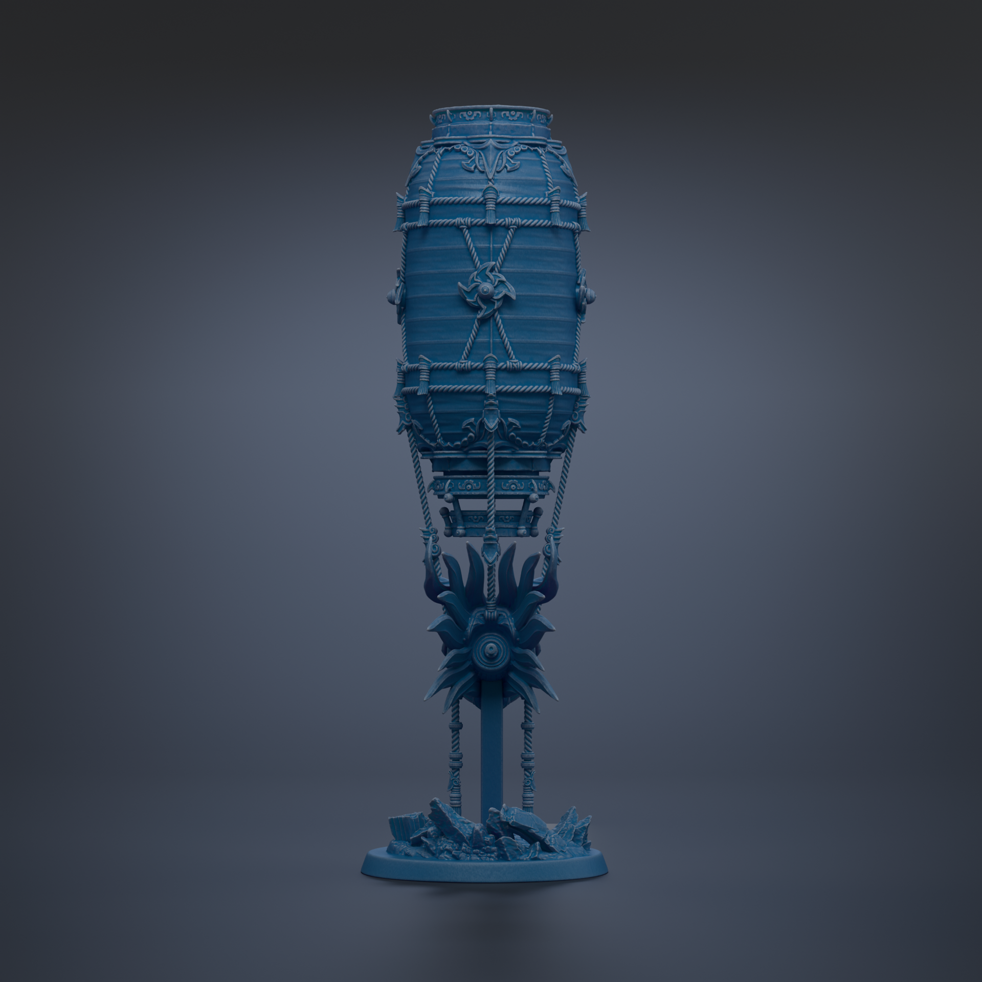 A blue, cylindrical object with intricate designs and decorations, standing alone against a dark background.