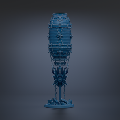 A blue, cylindrical object with intricate designs and decorations, standing alone against a dark background.