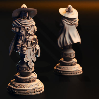 two ornate statues of a person wearing a hat and holding a shield, standing on pedestals against a dark background.