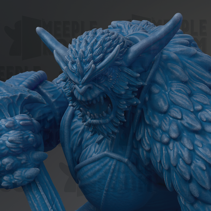 A close-up view of a blue, furry monster statue with sharp teeth and an intense expression.