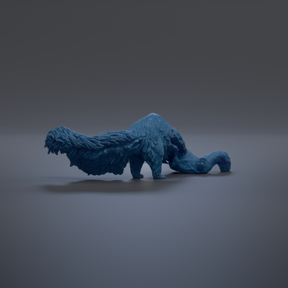 A blue, furry toy resembling a small animal or creature is shown in the image.