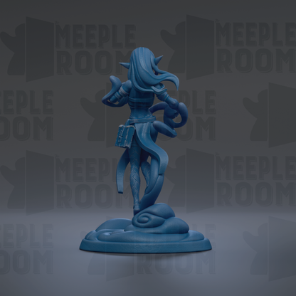 A blue figurine of a woman with long hair and a flowing skirt, standing on a base and holding a book.