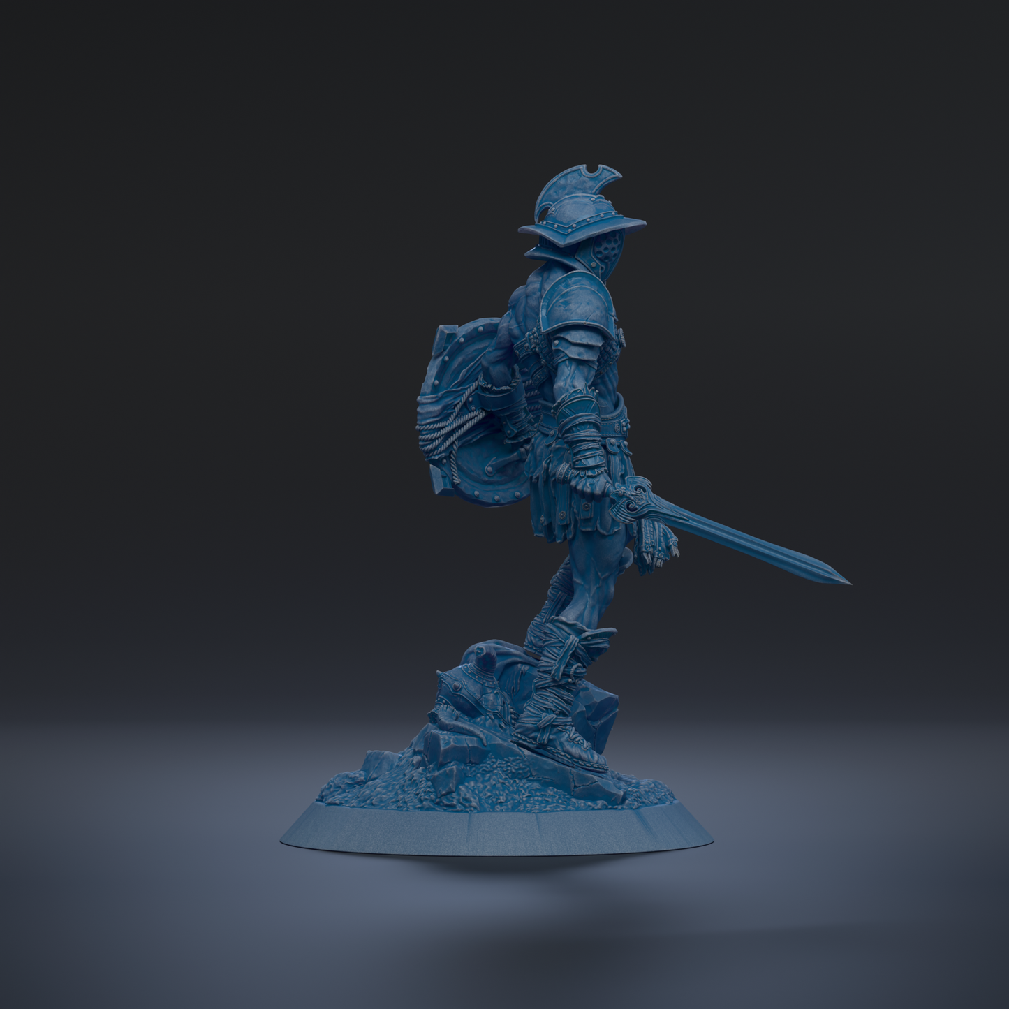 A blue statue of a warrior standing on a rock, holding a shield and sword.