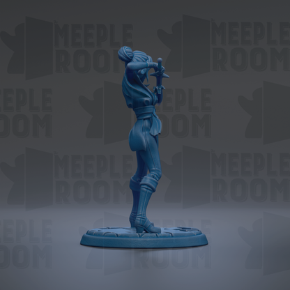 A blue figurine of a person standing on a platform, holding a weapon in their hands.