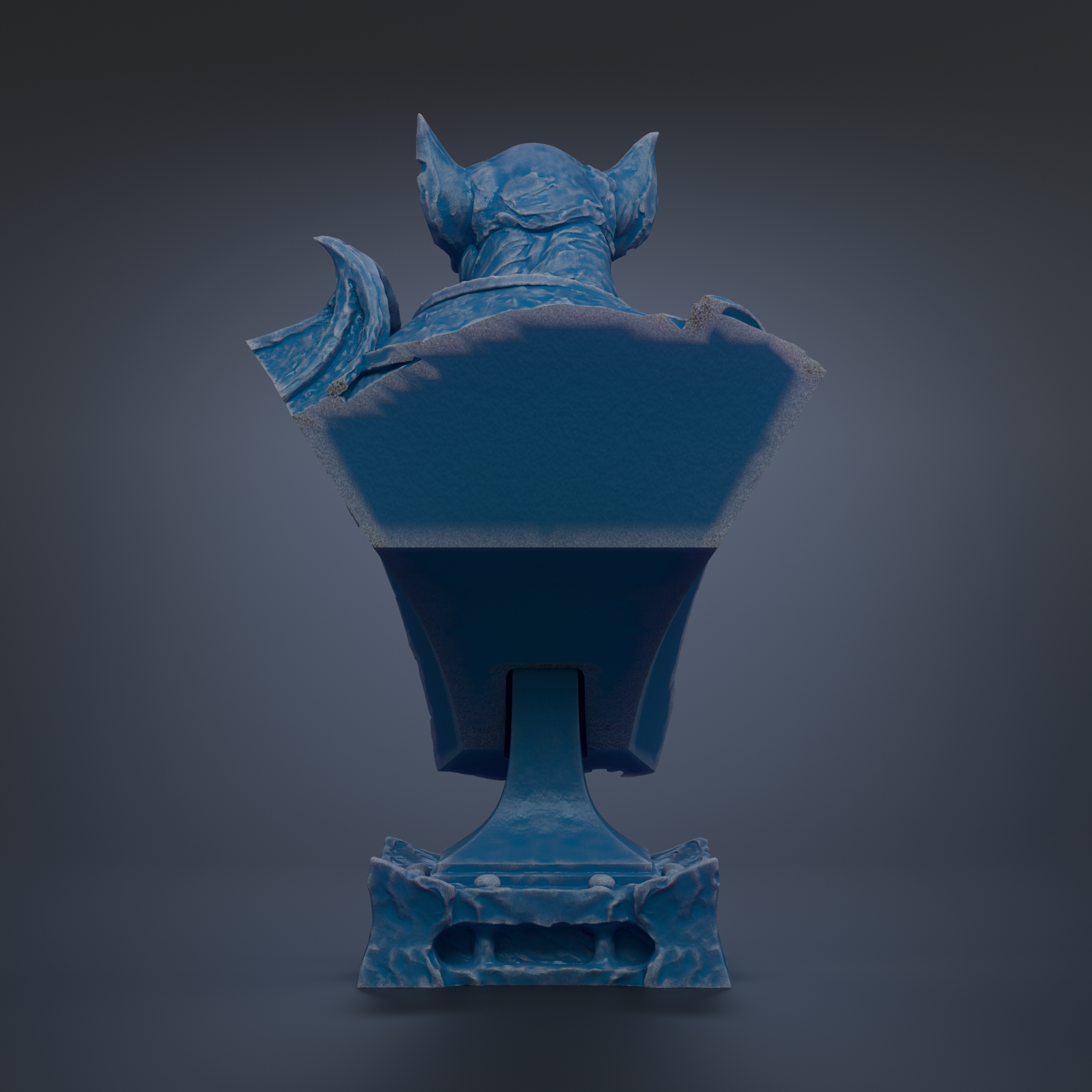 A blue bat statue with a textured surface and pointed ears, standing on a base.