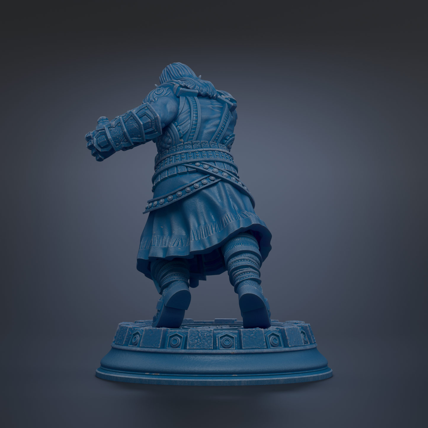 A blue statue of a person in a fighting stance, wearing a long coat and armor, standing on a platform.