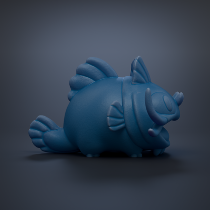A blue, cartoonish fish figurine is shown against a dark background.