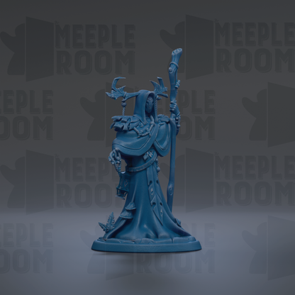A blue figurine of a wizard or magical figure, holding a staff and standing on a pedestal.
