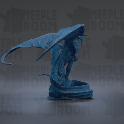 A blue dragon statue with outstretched wings, standing on a pedestal.