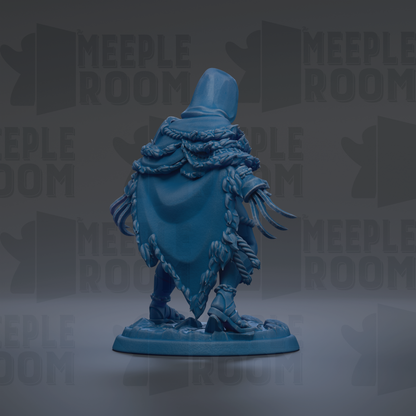 A blue figurine of a person wearing a hooded cloak, standing on a base.