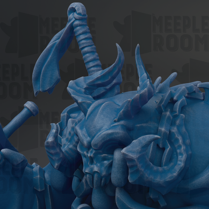 A close-up view of a blue, sculpted creature with sharp, jagged features and a fierce expression, set against a dark background.