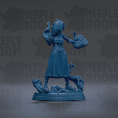 A blue figurine of a woman holding a fish and a snake, standing on a base.