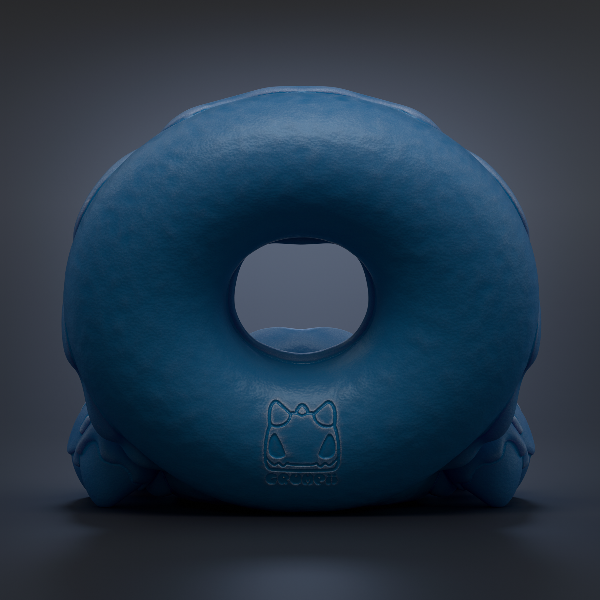 A blue donut-shaped object with a cat logo on it, set against a dark background.
