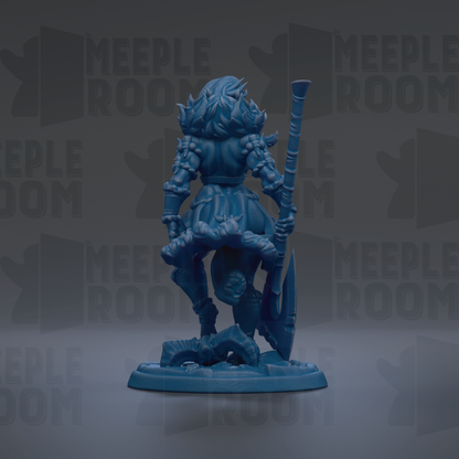 A blue figurine of a female character with a sword and shield, standing on a base.