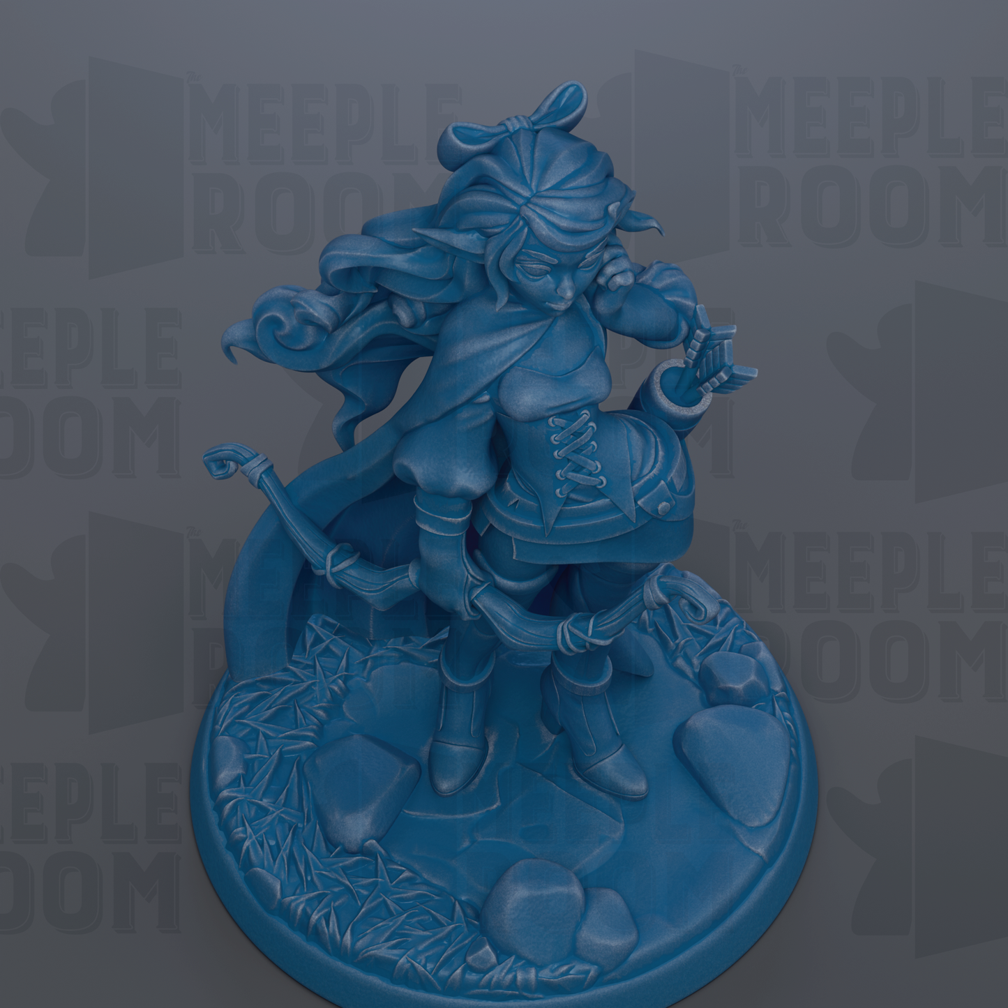 A blue figurine of a female character with flowing hair and a flowing cape, standing on a base with rocks and plants.