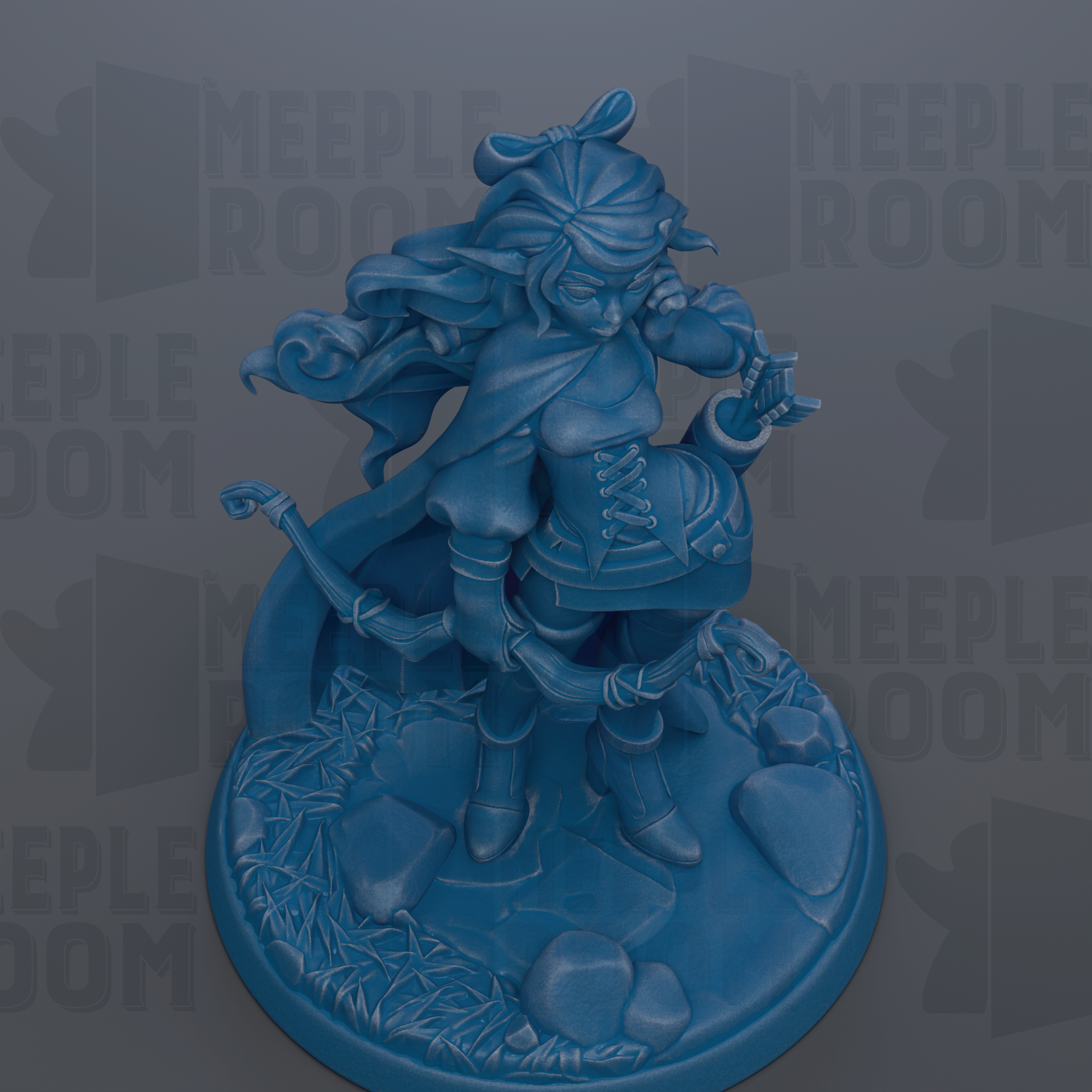 A blue figurine of a female character with flowing hair and a flowing cape, standing on a base with rocks and plants.