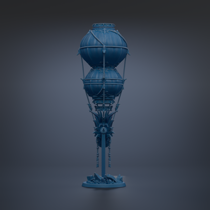 A blue, ornate lamp with a tall, cylindrical body and two spherical components, standing on a base with a decorative design.