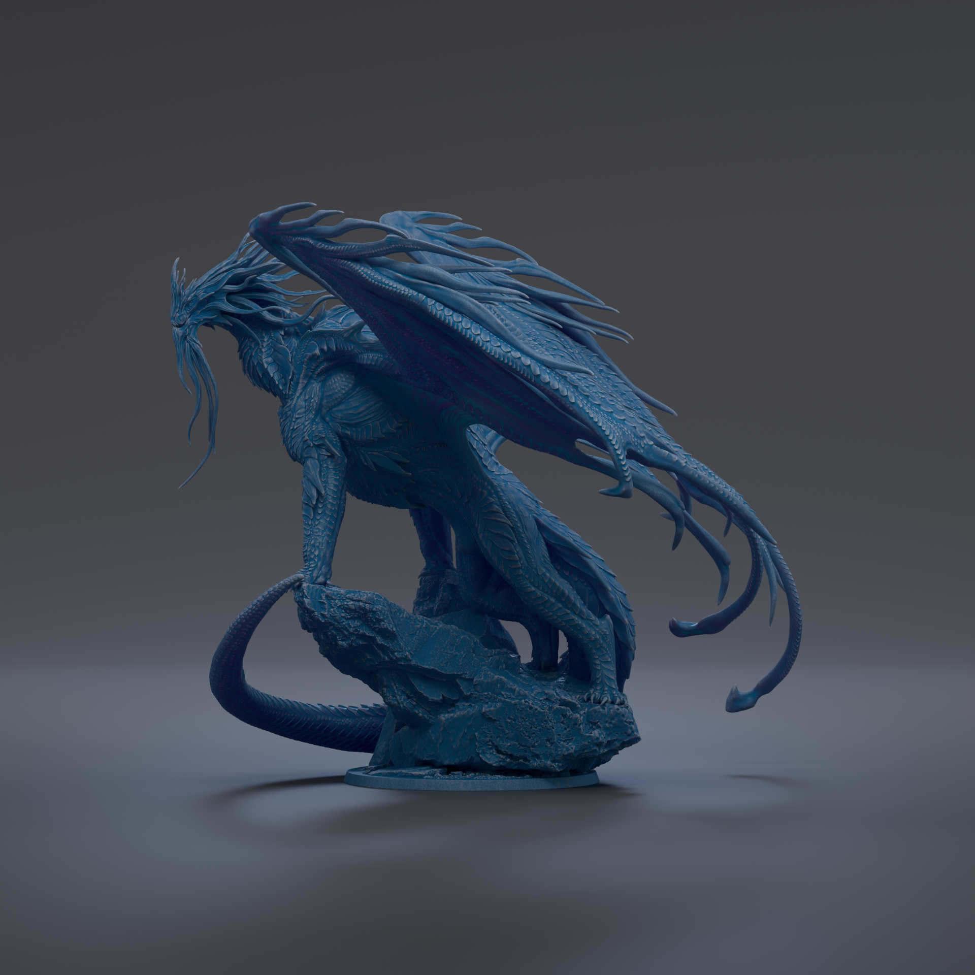 A blue dragon statue with outstretched wings and a fierce expression, standing on a rock formation against a dark background.