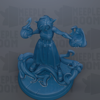 A blue figurine of a woman with a snake-like creature on her head, standing on a platform with a snake-like creature on her feet.